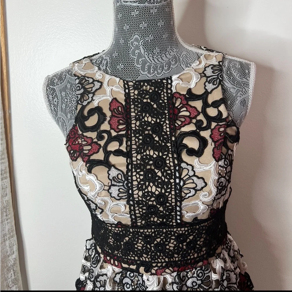 Monique Lhuillier gown with an all-over lace floral appliqué styling Gown - Picture 3 of 4